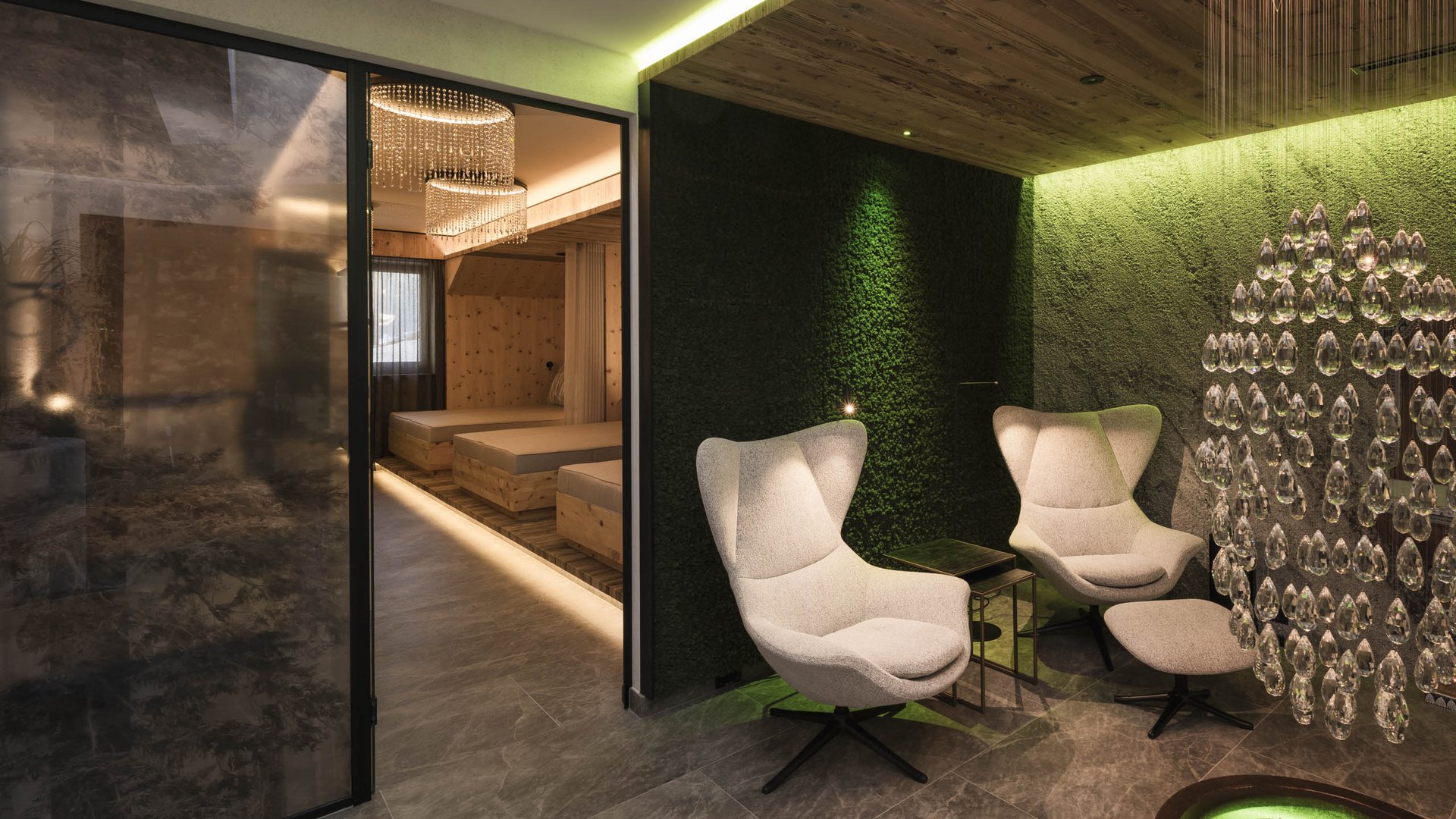 Cozy lounge area with chairs next to bedrooms in modern stylish interior