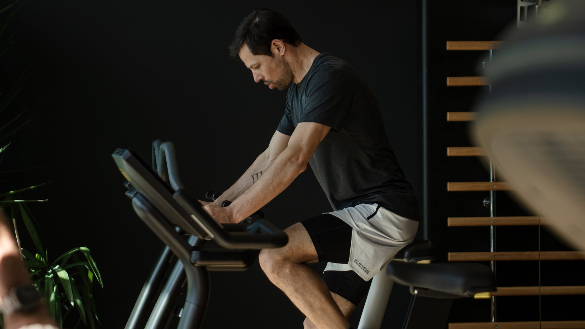 Man exercising on a stationary bike in a gym