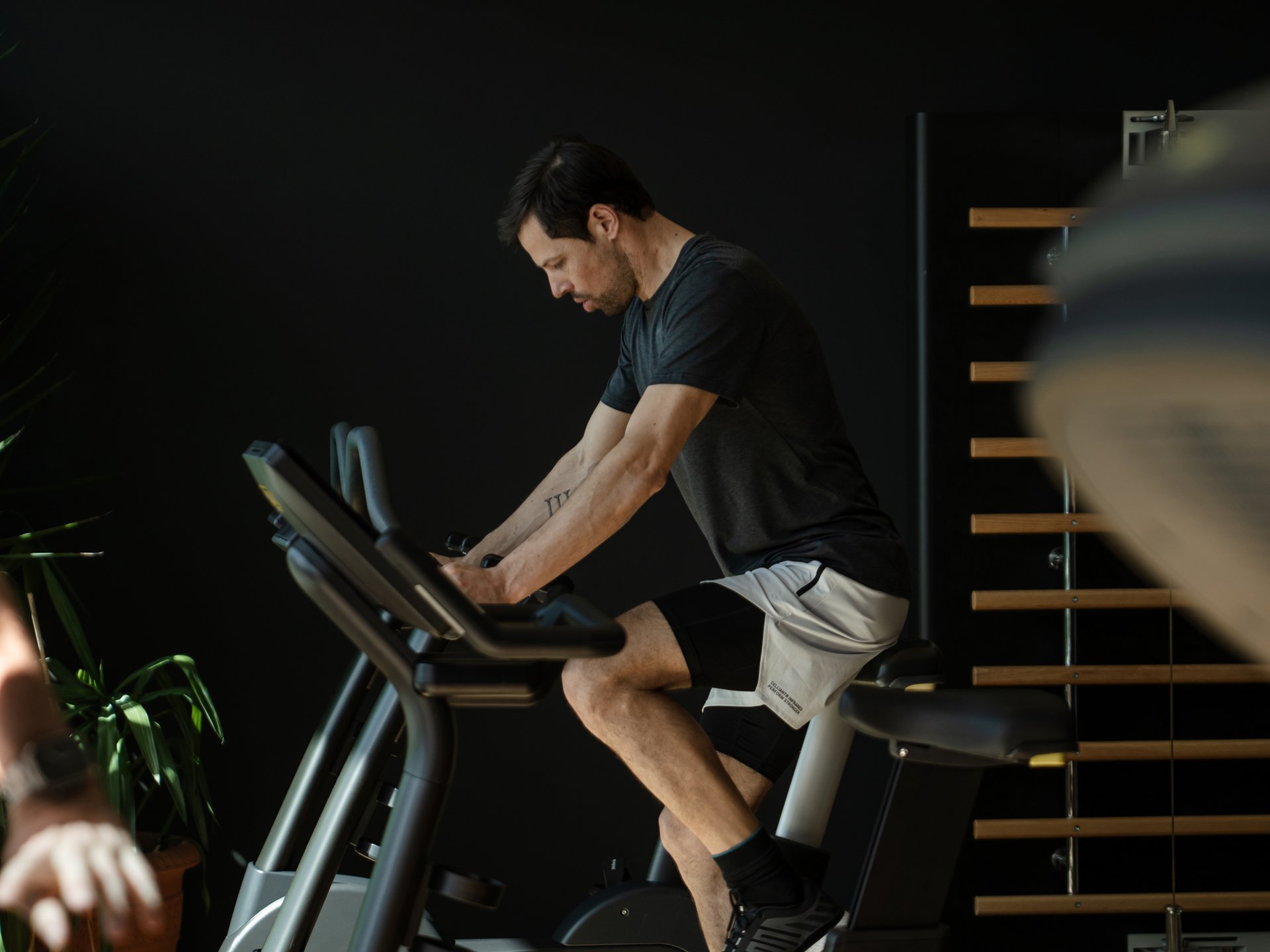 Man exercising on a stationary bike in a gym