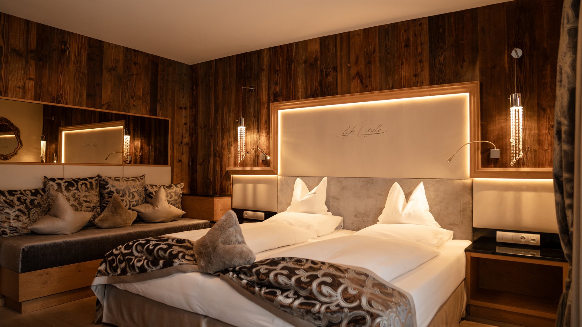 Cozy hotel room with wood paneling and modern decor