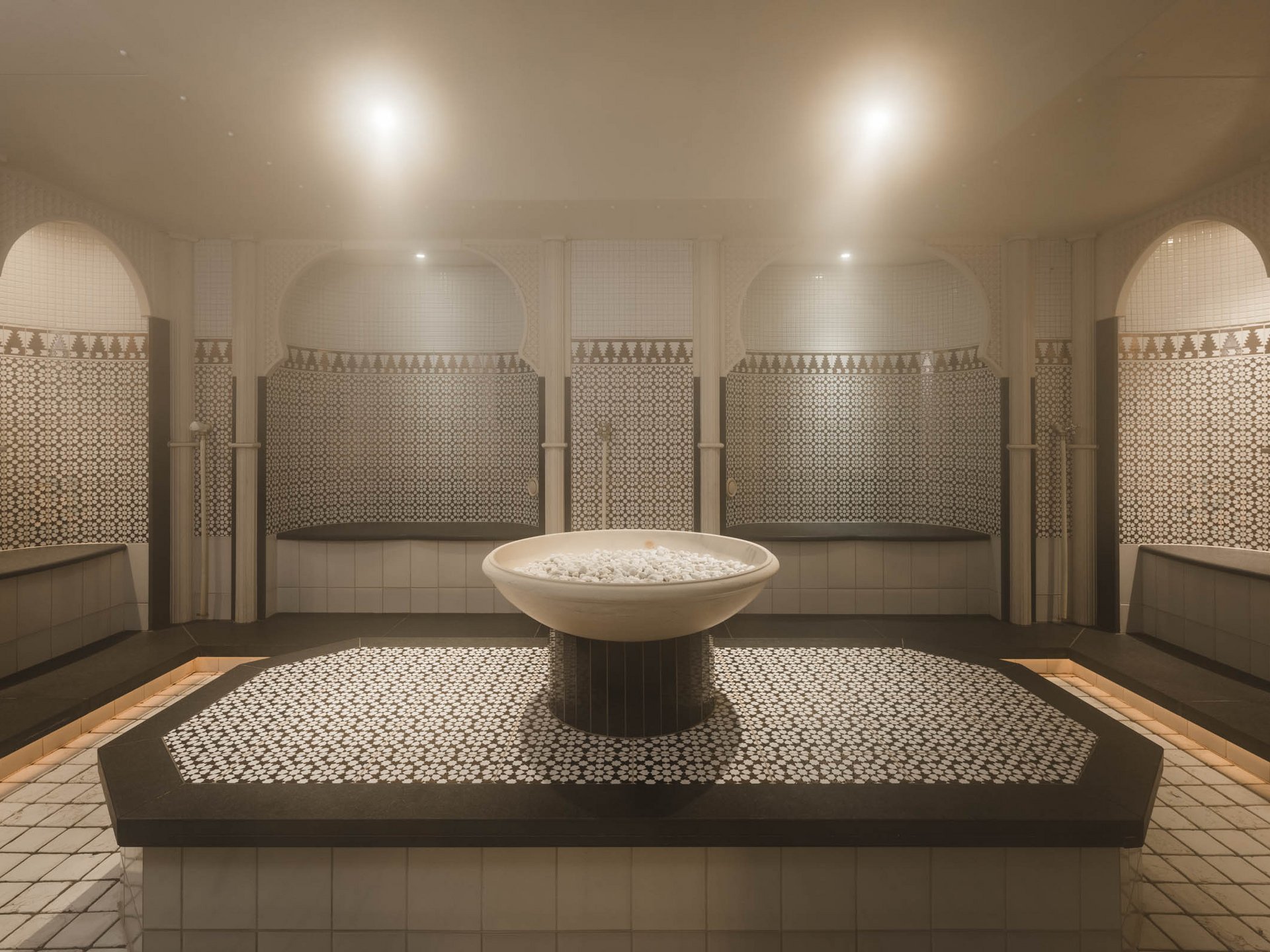 Traditional hamam with soap bowl and mosaic tiles