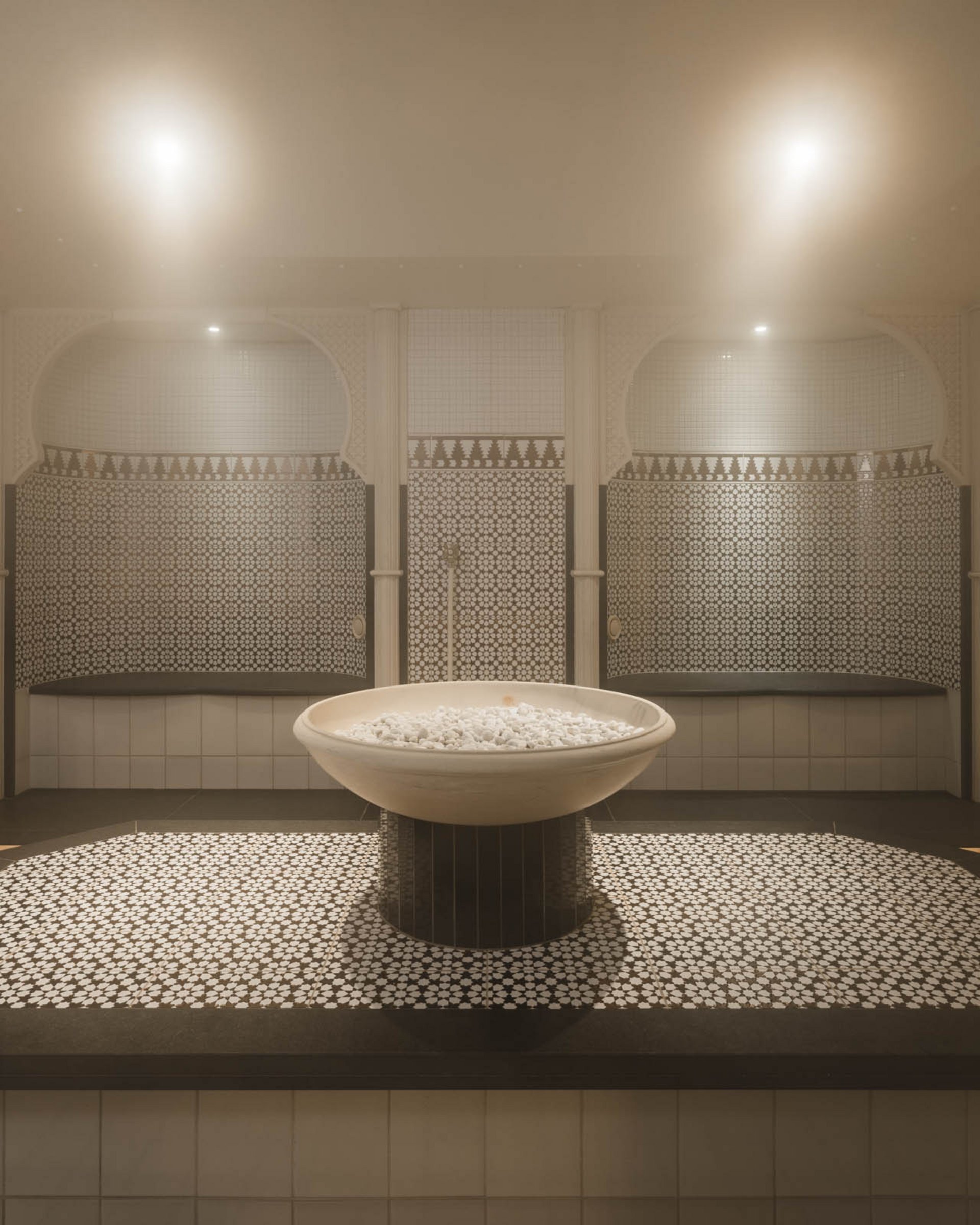 Traditional hamam with soap bowl and mosaic tiles