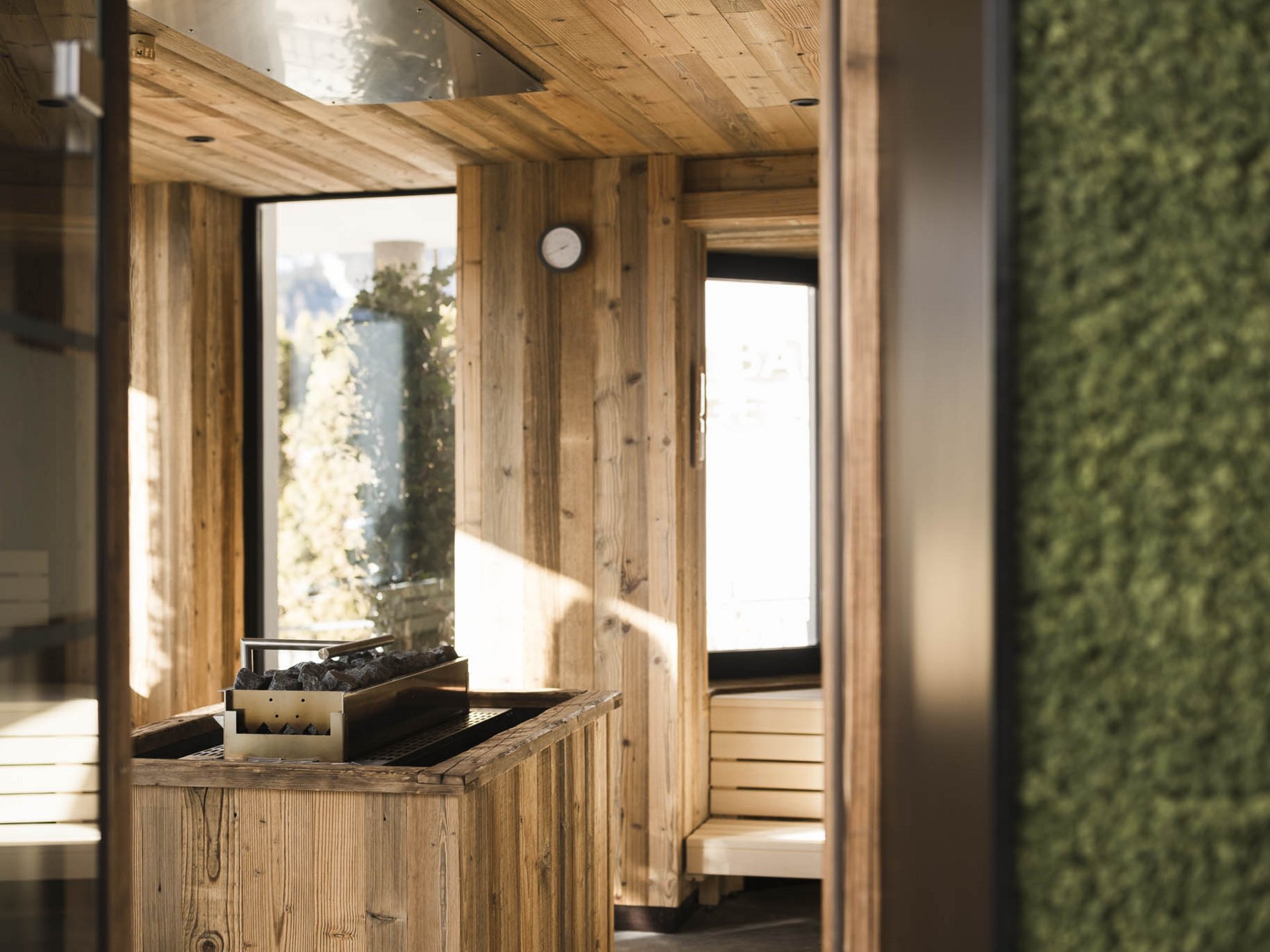 Interior of a wooden sauna with benches and a heater