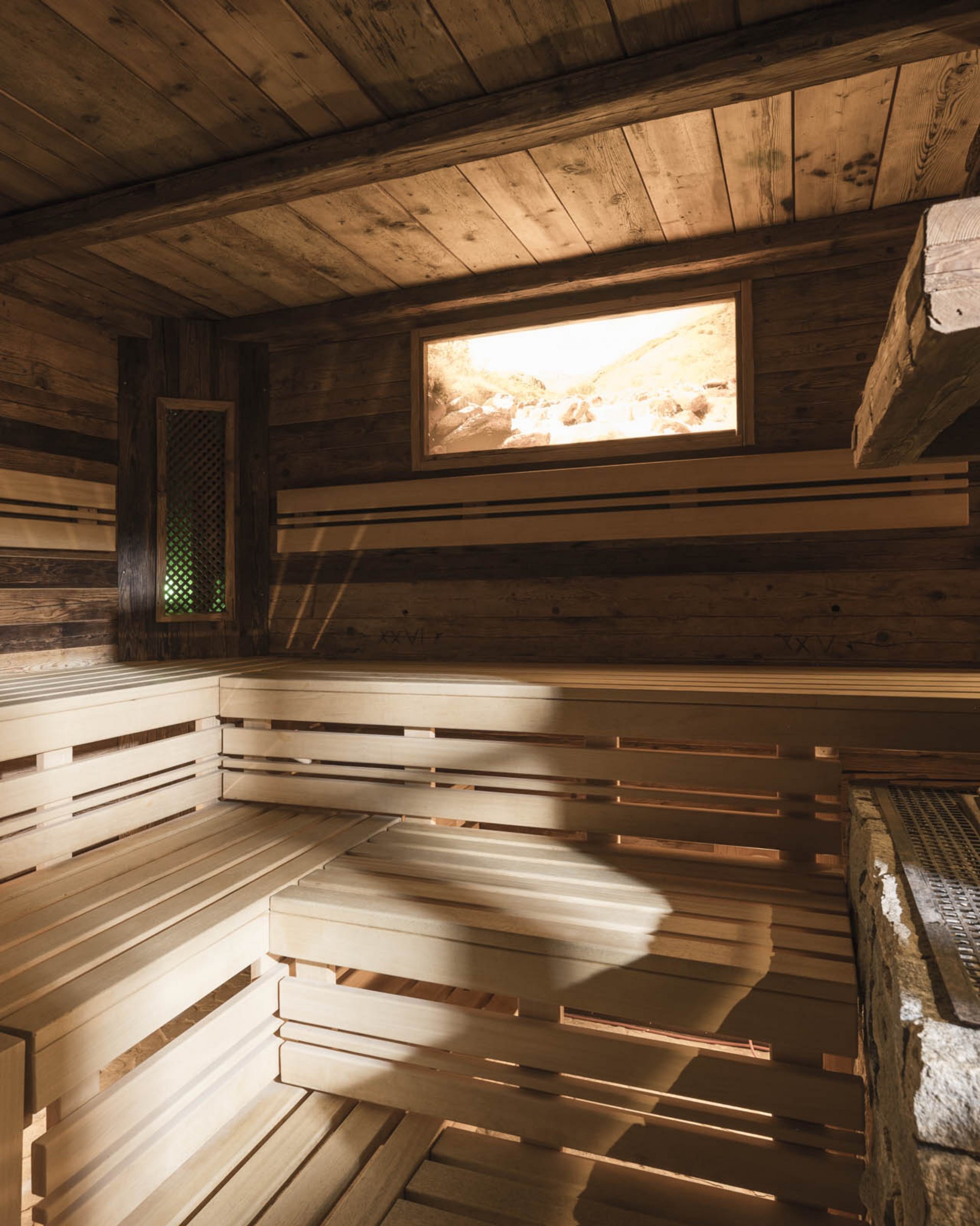 Wood sauna with stone stove and bench for relaxation