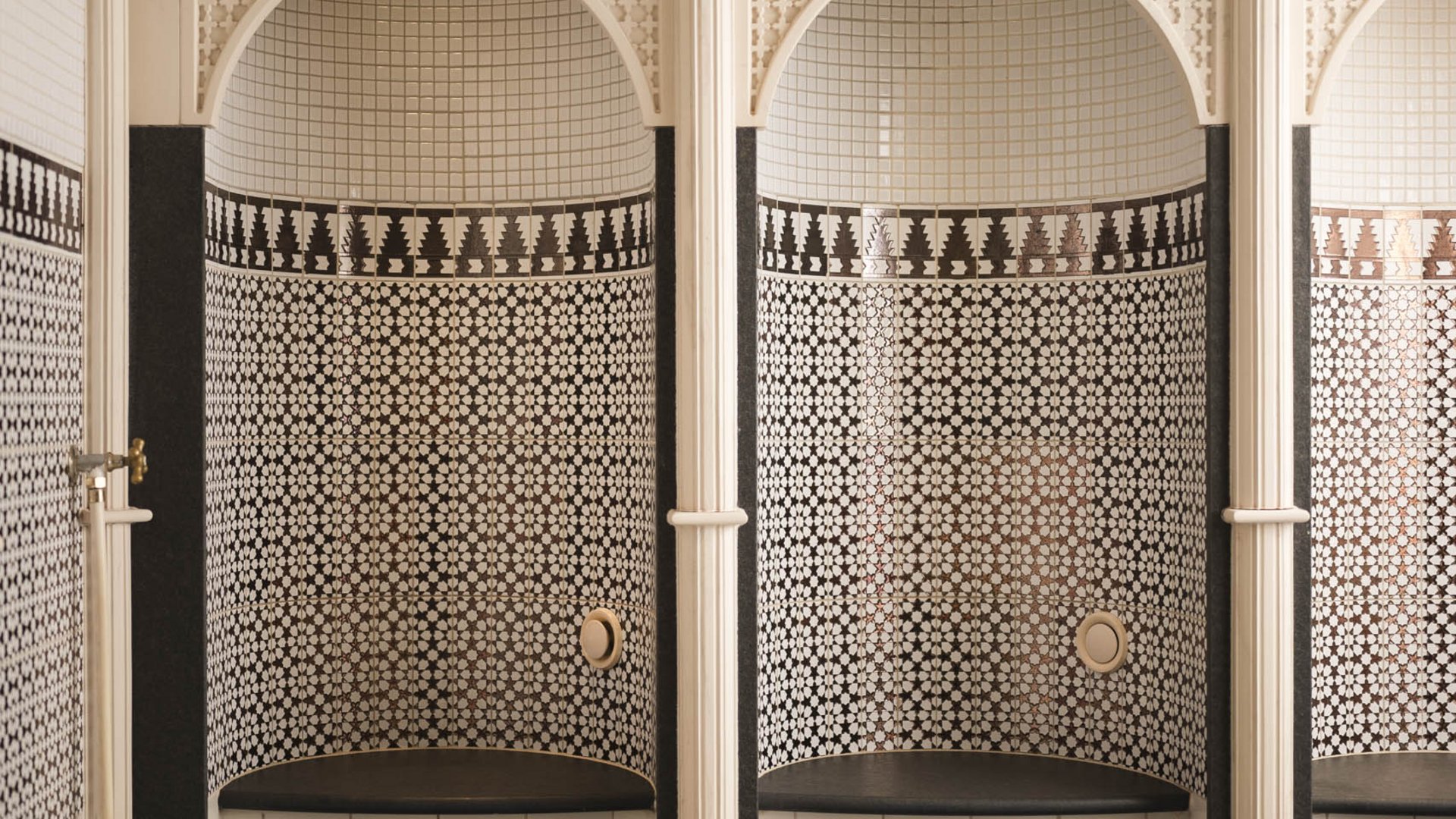 Traditional hammam with mosaic tiles and benches