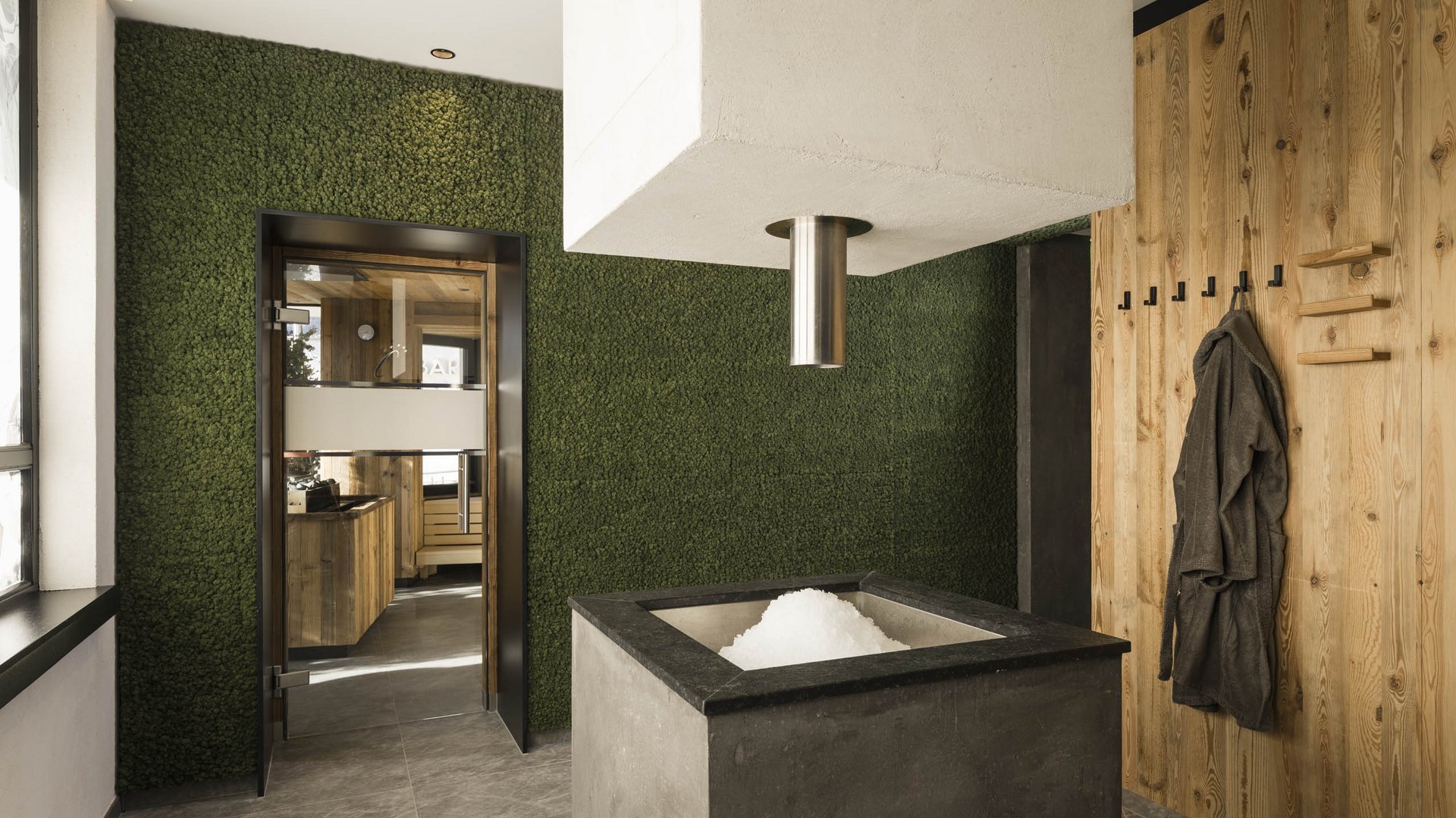 Modern sauna room with ice fountain and wooden walls