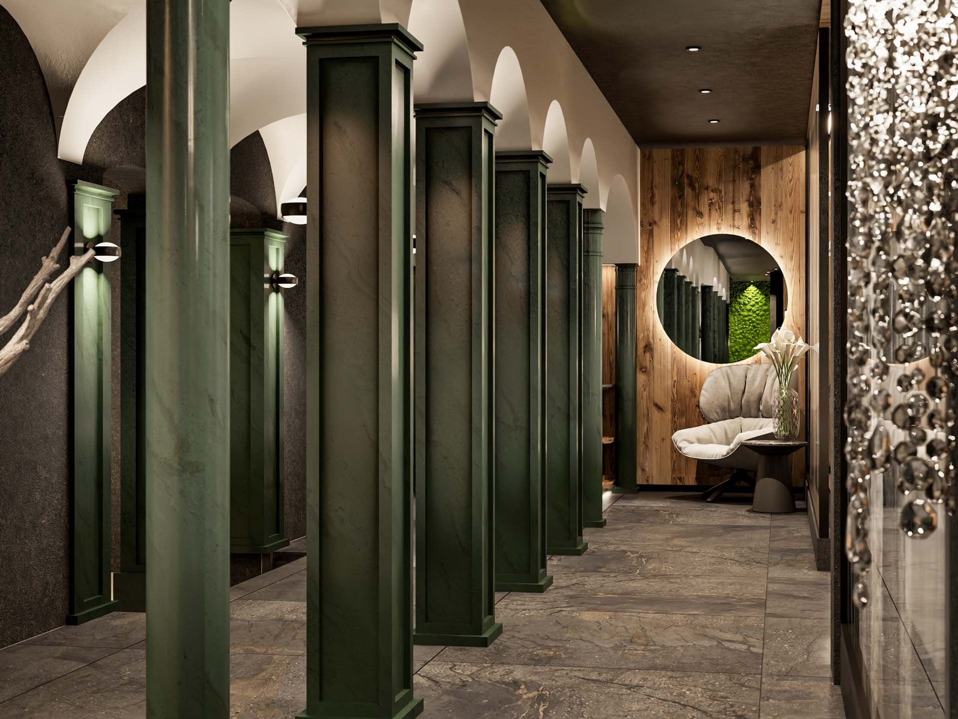 Hallway with green pillars, round mirror, cozy chair, and vase